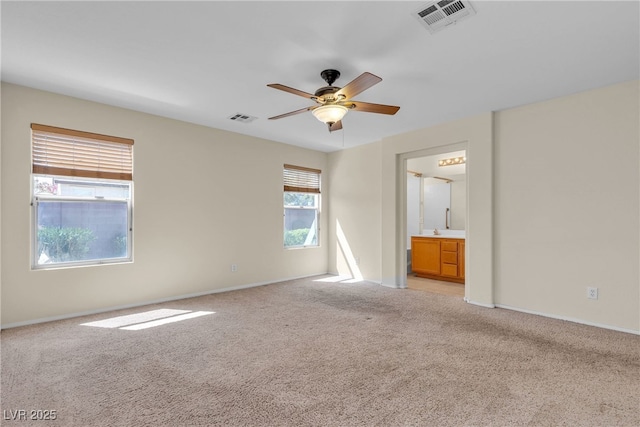 10791 Silver Lace Ln, Las Vegas, NV 89135 - empty room featuring light carpet, a ceiling fan, and baseboards