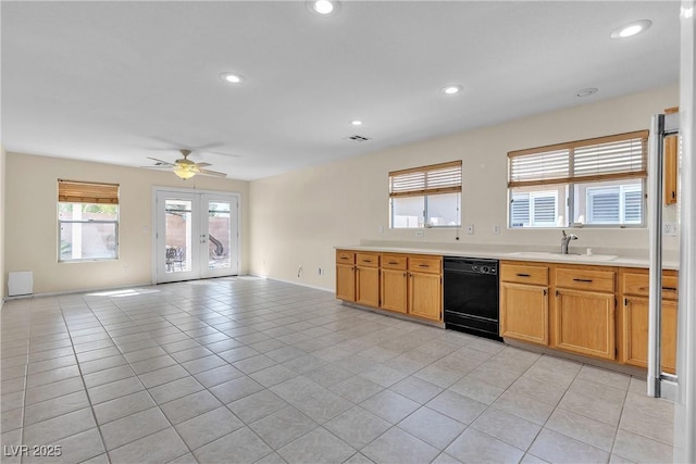 10791 Silver Lace Ln, Las Vegas, NV 89135 - kitchen with black dishwasher, light tile patterned flooring, a sink, light countertops, and a ceiling fan