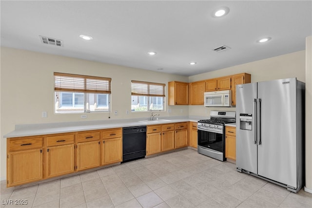 10791 Silver Lace Ln, Las Vegas, NV 89135 - kitchen featuring appliances with stainless steel finishes, a sink, light countertops, and recessed lighting