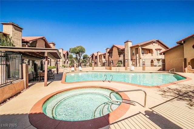 4083 Nook Way Unit D, Las Vegas, NV 89103 - community pool with a hot tub, a residential view, and a patio area