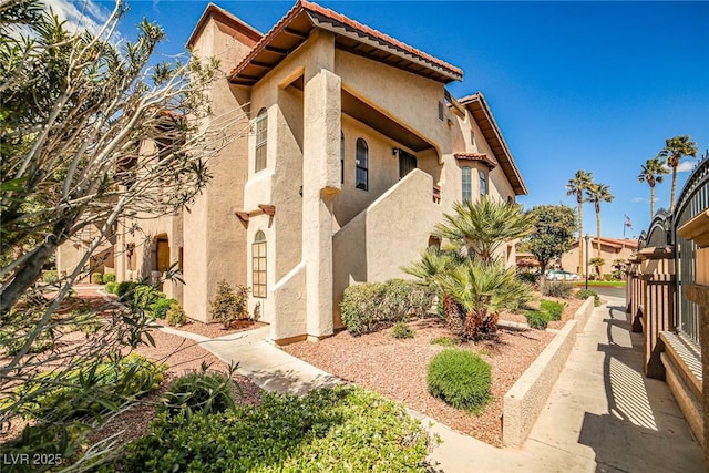 4083 Nook Way Unit D, Las Vegas, NV 89103 - view of home's exterior with stucco siding and a tiled roof