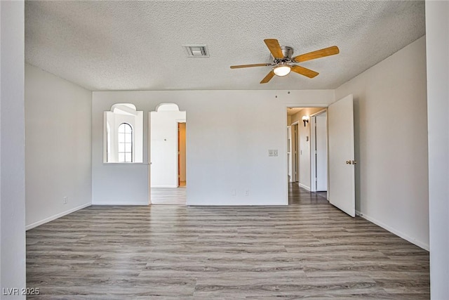 4083 Nook Way Unit D, Las Vegas, NV 89103 - empty room featuring wood finished floors, ceiling fan, a textured ceiling, and baseboards