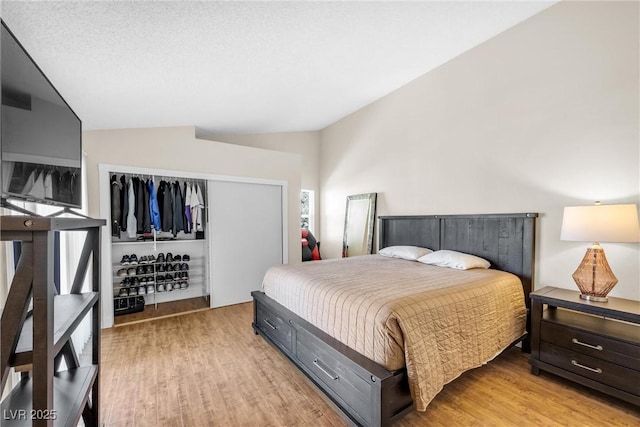 8932 Antioch Way, Las Vegas, NV 89117 - bedroom featuring vaulted ceiling, light wood-type flooring, and a closet
