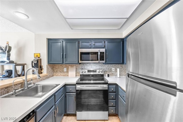 8932 Antioch Way, Las Vegas, NV 89117 - kitchen featuring stainless steel appliances, a sink, light countertops, and tasteful backsplash