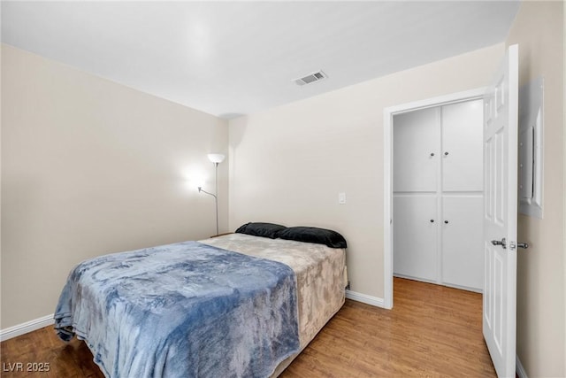 8932 Antioch Way, Las Vegas, NV 89117 - bedroom featuring baseboards, wood finished floors, and electric panel