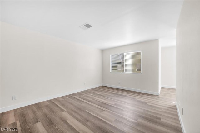 1832 N Decatur Blvd Unit 104, Las Vegas, NV 89108 - spare room with light wood-style floors and baseboards