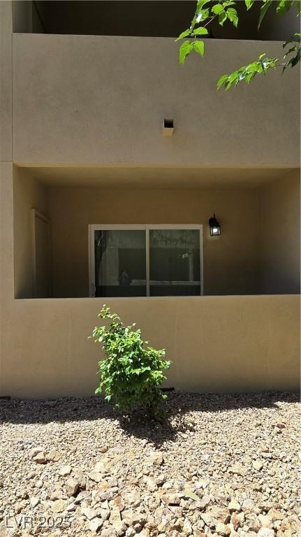 1832 N Decatur Blvd Unit 104, Las Vegas, NV 89108 - view of home's exterior featuring stucco siding