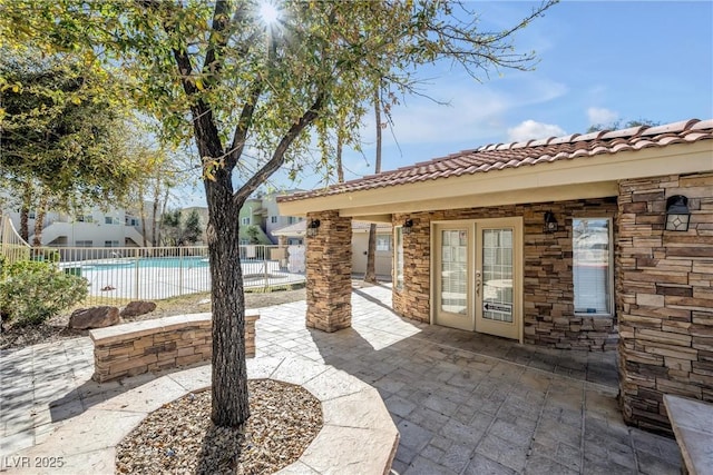 1832 N Decatur Blvd Unit 104, Las Vegas, NV 89108 - view of patio / terrace with french doors and a community pool