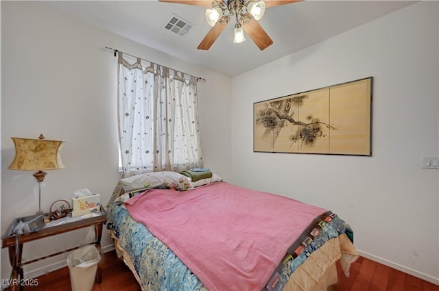 5548 Spearfish Lake Ct, Las Vegas, NV 89148 - bedroom with baseboards, wood finished floors, and ceiling fan