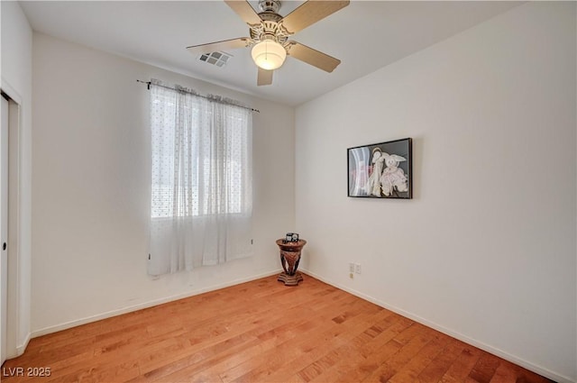 5548 Spearfish Lake Ct, Las Vegas, NV 89148 - unfurnished room featuring light wood-style floors, baseboards, and a ceiling fan