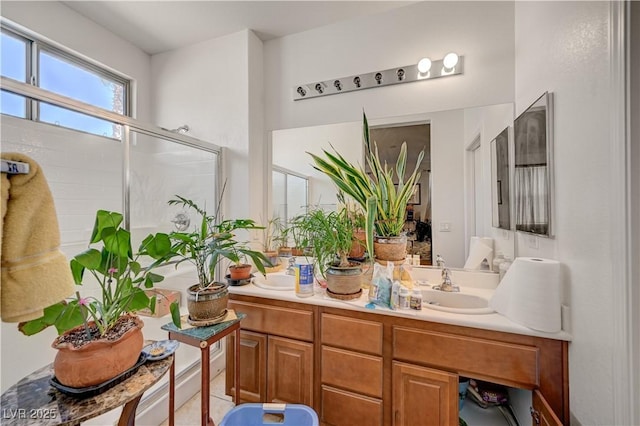 5548 Spearfish Lake Ct, Las Vegas, NV 89148 - bathroom with double vanity and an enclosed shower