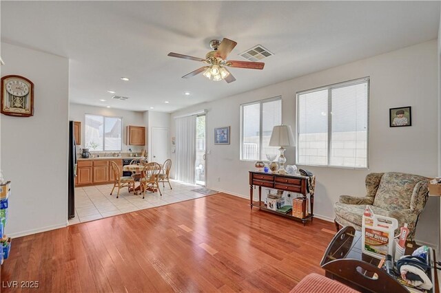 5548 Spearfish Lake Ct, Las Vegas, NV 89148 - living area featuring a ceiling fan, light wood finished floors, baseboards, and recessed lighting