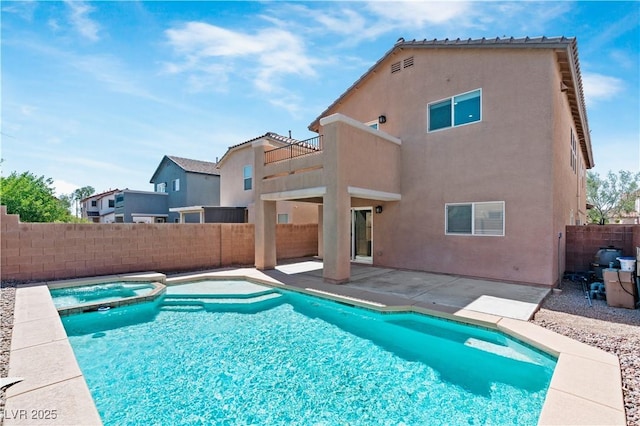 5116 Iron Crossing Ave, Las Vegas, NV 89131 - view of pool featuring a fenced backyard, a patio area, and a pool with connected hot tub