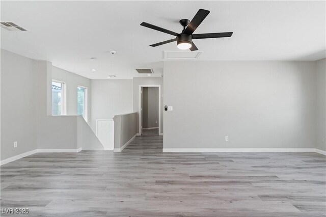 5116 Iron Crossing Ave, Las Vegas, NV 89131 - unfurnished room with baseboards and light wood-style flooring