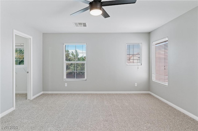 5116 Iron Crossing Ave, Las Vegas, NV 89131 - unfurnished room featuring light carpet, a ceiling fan, and baseboards
