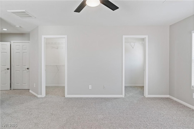 5116 Iron Crossing Ave, Las Vegas, NV 89131 - unfurnished bedroom with a walk in closet, carpet flooring, baseboards, a closet, and ceiling fan