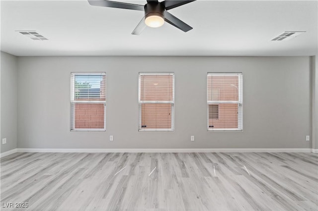 5116 Iron Crossing Ave, Las Vegas, NV 89131 - unfurnished room featuring light wood-type flooring, baseboards, and a ceiling fan