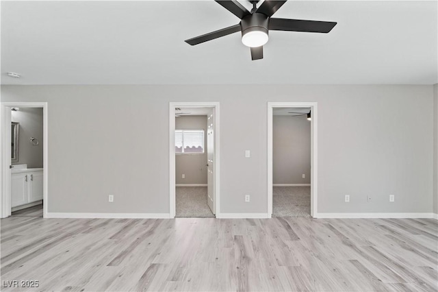 5116 Iron Crossing Ave, Las Vegas, NV 89131 - unfurnished bedroom featuring a spacious closet, light wood-style flooring, ensuite bath, and baseboards