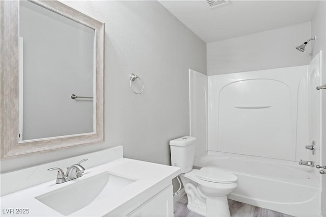 5116 Iron Crossing Ave, Las Vegas, NV 89131 - full bathroom featuring tub / shower combination, vanity, toilet, and wood finished floors