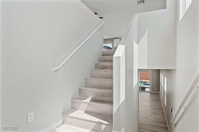 5116 Iron Crossing Ave, Las Vegas, NV 89131 - stairway with baseboards and wood finished floors