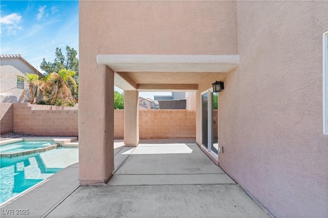 5116 Iron Crossing Ave, Las Vegas, NV 89131 - fenced backyard with a patio and a pool with connected hot tub