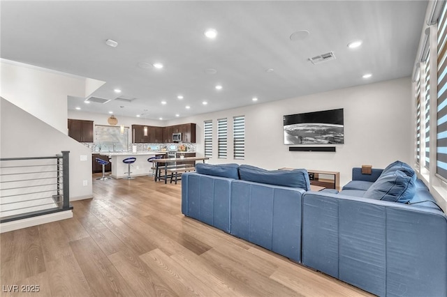 8076 Haywood Estate Ave, Las Vegas, NV 89113 - living room featuring recessed lighting and light wood-style floors