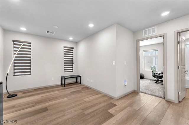8076 Haywood Estate Ave, Las Vegas, NV 89113 - unfurnished living room with light wood-type flooring, baseboards, and recessed lighting