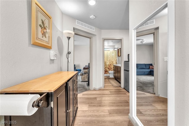 8076 Haywood Estate Ave, Las Vegas, NV 89113 - corridor with light wood-style flooring