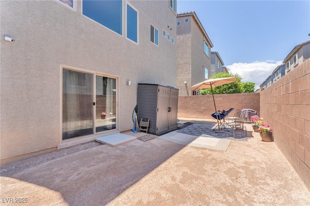 8076 Haywood Estate Ave, Las Vegas, NV 89113 - fenced backyard with a patio area