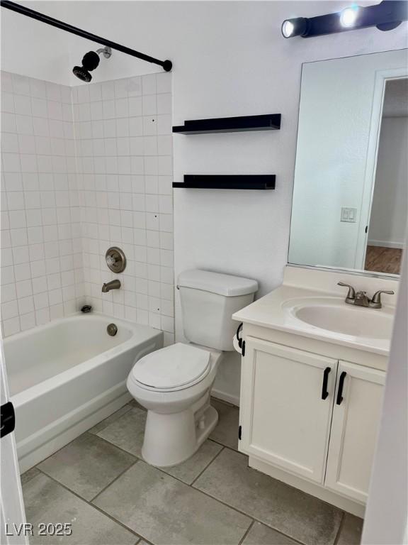 1320 Driscoll Dr Unit 202, Las Vegas, NV 89128 - bathroom featuring tile patterned floors, toilet, bathing tub / shower combination, and vanity