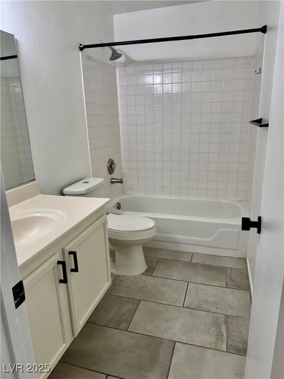 1320 Driscoll Dr Unit 202, Las Vegas, NV 89128 - full bath featuring shower / bath combination, vanity, tile patterned flooring, and toilet