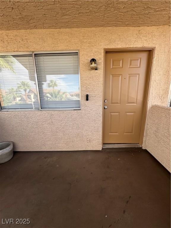 1320 Driscoll Dr Unit 202, Las Vegas, NV 89128 - doorway to property with stucco siding