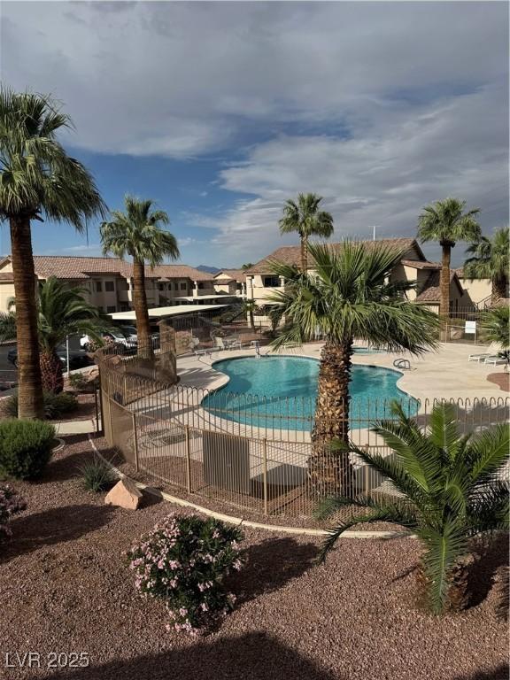 1320 Driscoll Dr Unit 202, Las Vegas, NV 89128 - community pool featuring a patio