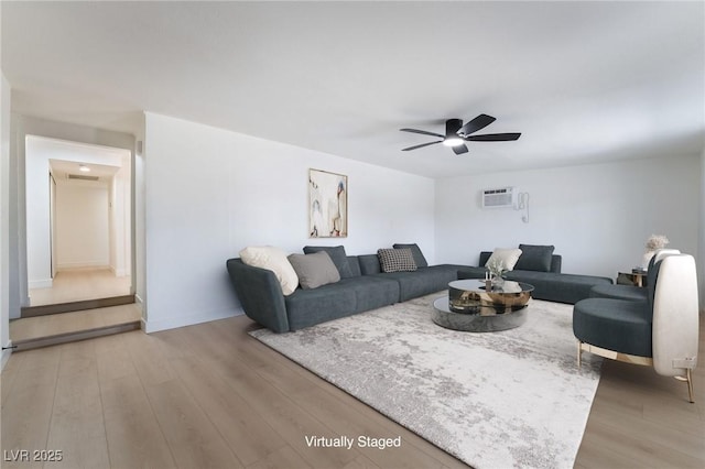 5069 Hallet Dr, Las Vegas, NV 89122 - living area with ceiling fan, light wood-type flooring, and baseboards