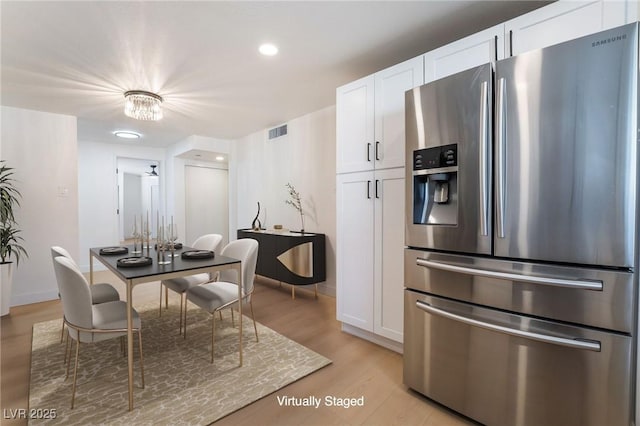 5069 Hallet Dr, Las Vegas, NV 89122 - dining space featuring light wood-style floors, recessed lighting, and baseboards