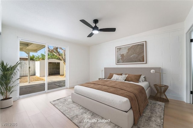 5069 Hallet Dr, Las Vegas, NV 89122 - bedroom with access to outside, wood finished floors, and ceiling fan