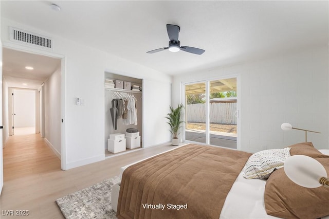 5069 Hallet Dr, Las Vegas, NV 89122 - bedroom featuring access to exterior, light wood-type flooring, a closet, a ceiling fan, and baseboards