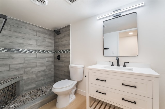 5069 Hallet Dr, Las Vegas, NV 89122 - bathroom with a tile shower, toilet, vanity, and wood finished floors