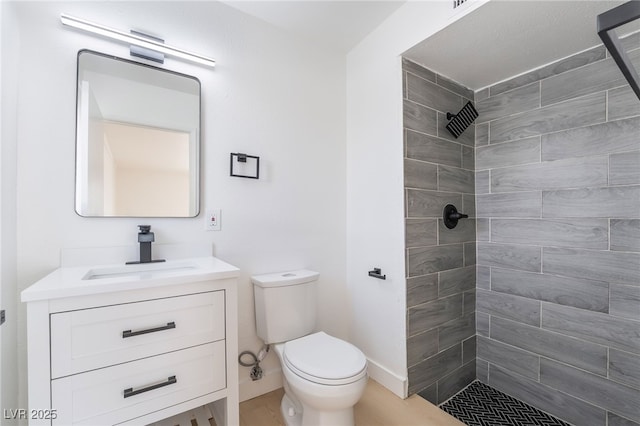 5069 Hallet Dr, Las Vegas, NV 89122 - bathroom featuring tiled shower, toilet, and vanity