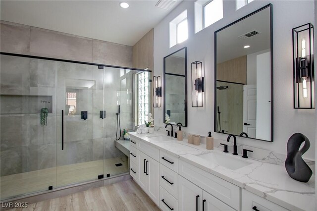 10025 Netherton Dr, Las Vegas, NV 89134 - full bath with a stall shower, double vanity, recessed lighting, and wood finished floors