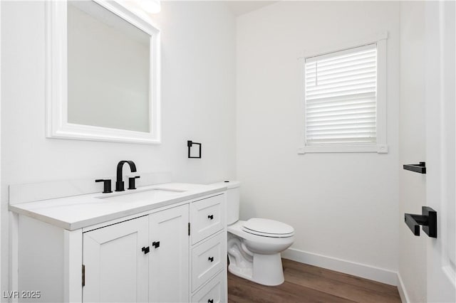25 Blue Valley Dr, Henderson, NV 89002 - bathroom featuring vanity, wood finished floors, toilet, and baseboards