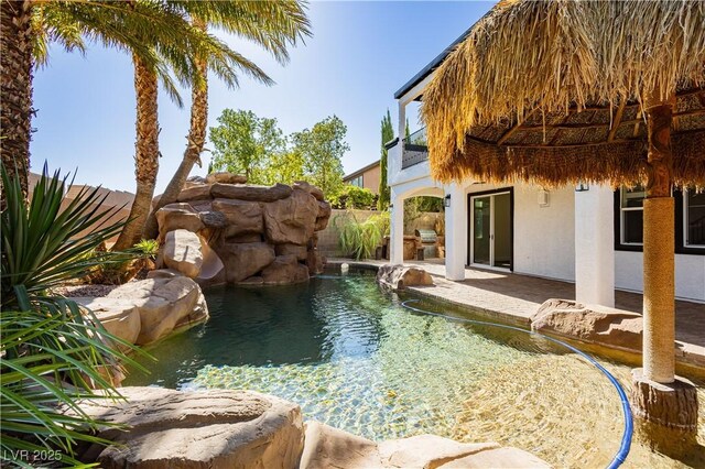 25 Blue Valley Dr, Henderson, NV 89002 - view of pool with a patio area, a small pond, and area for grilling
