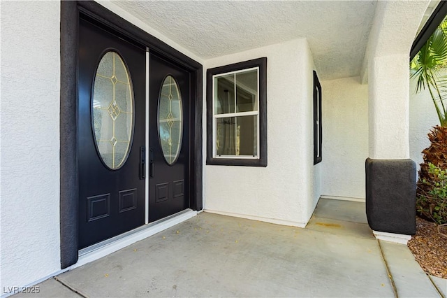 25 Blue Valley Dr, Henderson, NV 89002 - doorway to property with stucco siding