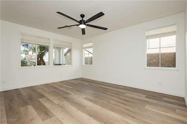 25 Blue Valley Dr, Henderson, NV 89002 - unfurnished room featuring plenty of natural light, wood finished floors, and ceiling fan