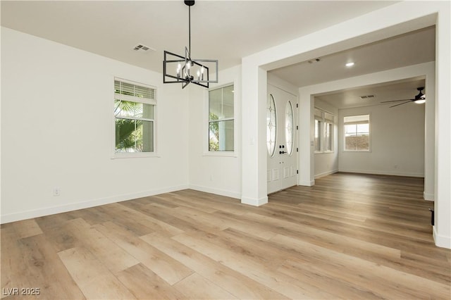 25 Blue Valley Dr, Henderson, NV 89002 - unfurnished dining area featuring a chandelier, light wood finished floors, baseboards, and a ceiling fan