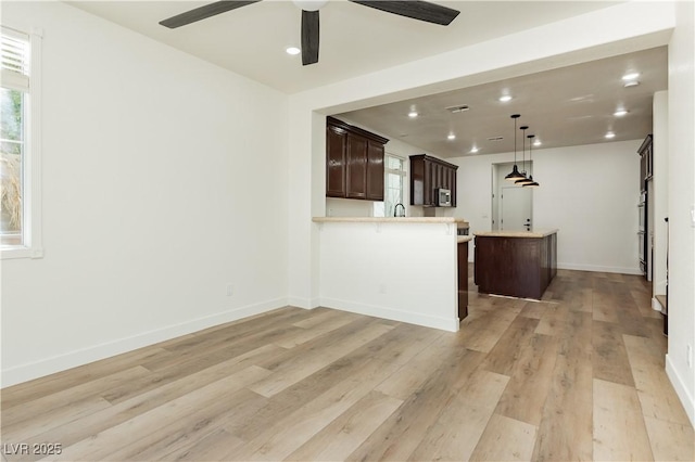 25 Blue Valley Dr, Henderson, NV 89002 - unfurnished living room with light wood-style floors, a ceiling fan, recessed lighting, plenty of natural light, and baseboards