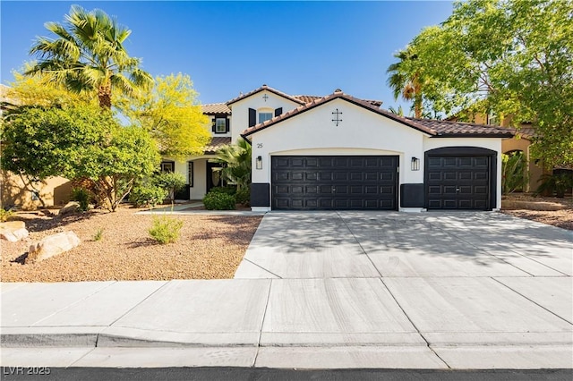 25 Blue Valley Dr, Henderson, NV 89002 - mediterranean / spanish house featuring a garage, stucco siding, a tiled roof, and concrete driveway