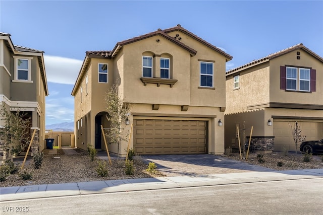 2417 Fasano St, Henderson, NV 89044 - view of front of house with an attached garage, stucco siding, driveway, and a tile roof