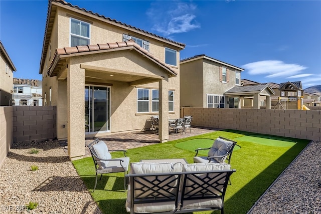 2417 Fasano St, Henderson, NV 89044 - rear view of house with stucco siding, a fenced backyard, a patio area, outdoor lounge area, and a tile roof