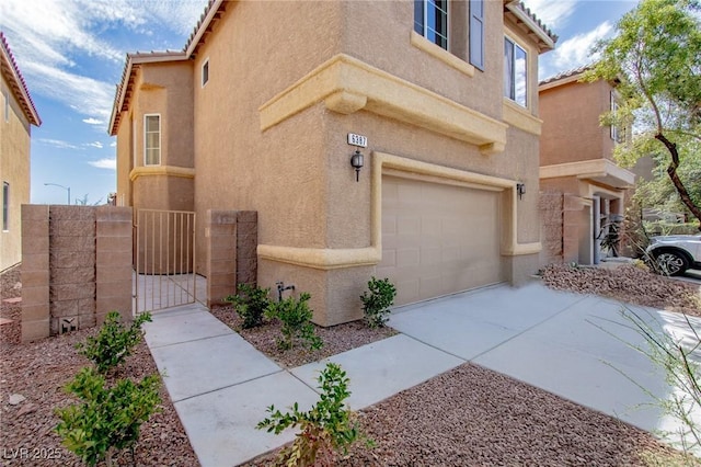 6387 Azurelyn Ave, Las Vegas, NV 89122 - doorway to property with stucco siding, a gate, a garage, concrete driveway, and a tile roof